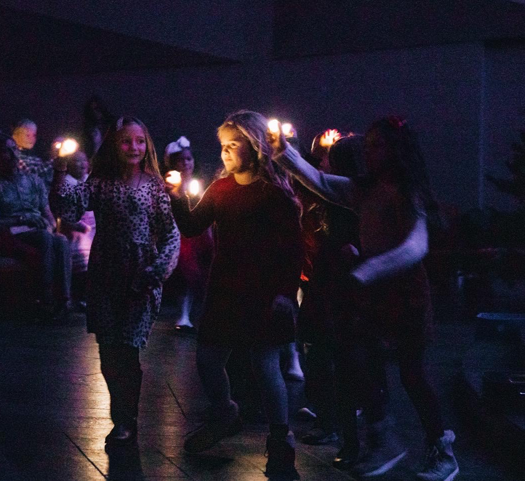 1 & 2 grades movement with lights and 3 & 4 grade hand drum performance